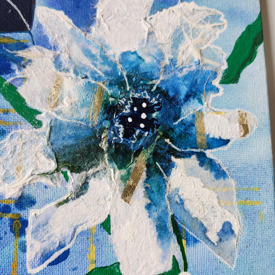 Framed blue and yellow flower artwork