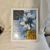 Framed blue and yellow flower artwork