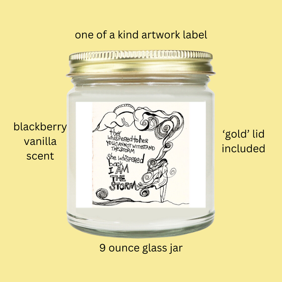 this is a 9 oz candle in a glass jar with a gold lid that features original artwork on the label 