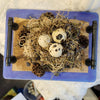 this is a creation by artist Christine c.  it is a birds nest on a tray with handles that contains dried lavendar and real quail egg shells.  