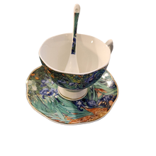  this set includes a tea cup, saucer and spoon.  the print is vincent van gogh "blue iris'