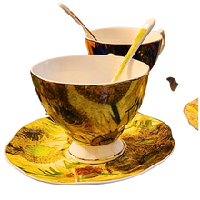  3 piece matching  teacup saucer and spoon set.  elegant design inspired by Vincent Van Gogh artwork with yellow sunflowers.