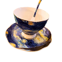  artfully designed tea cup. saucer, and spoon with starry night print